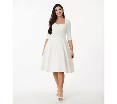 Unique Vintage 1950s Ivory Pleated Bust Swing Dress 1 101120-unique-vintage-1950s-ivory-pleated-bust-swing-dress-1.webp