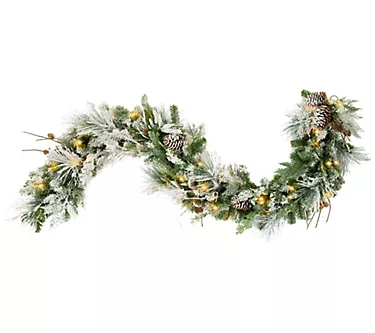 373623-haute-decor-snowfall-creek-6-pre-lit-flocked-garland-1.webp