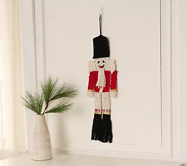Home Reflections 24" Woven Fabric Hanging Nutcracker 1 374288-home-reflections-24-woven-fabric-hanging-nutcracker-1.webp
